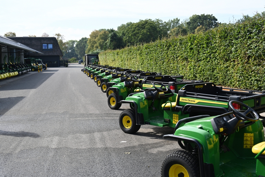 Line-up of John Deere machines in front of the maintenance facility